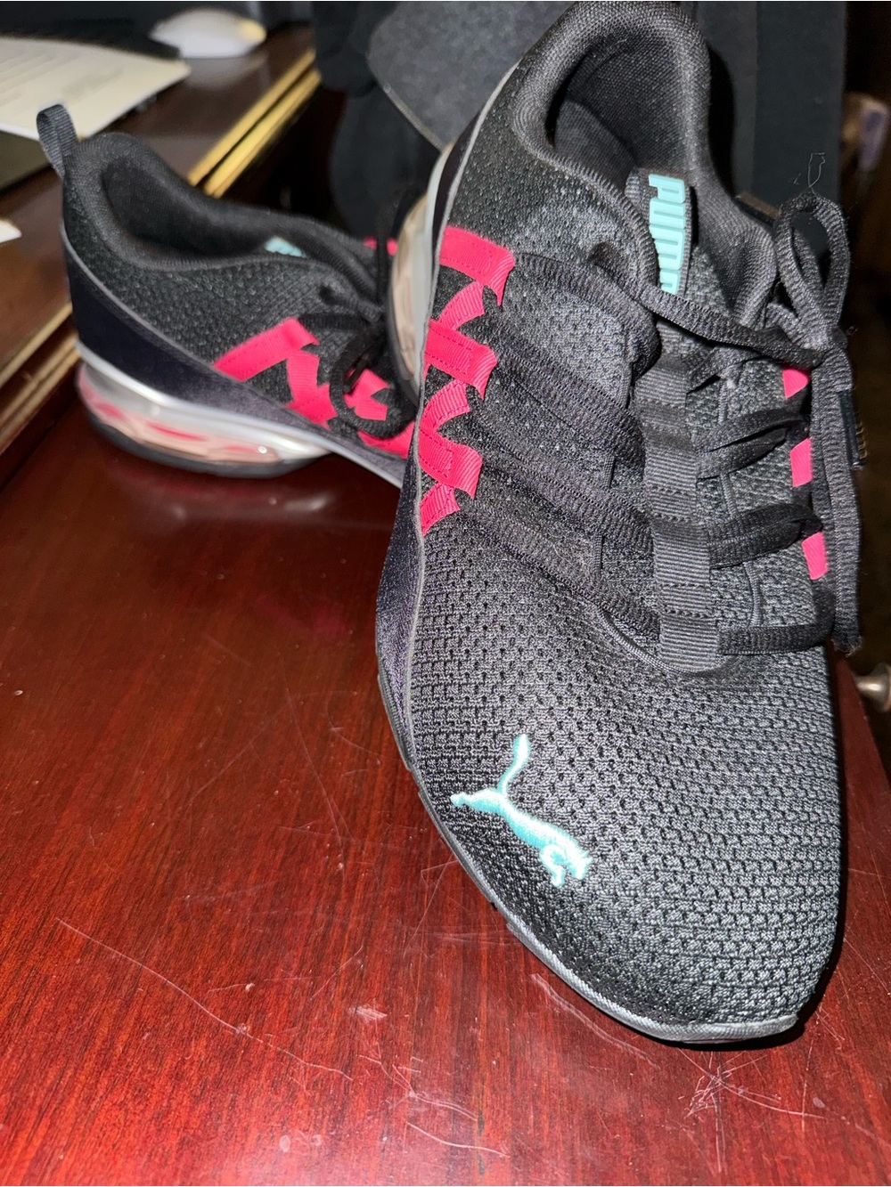 Puma Black Knit Sneakers with Pink Accents.